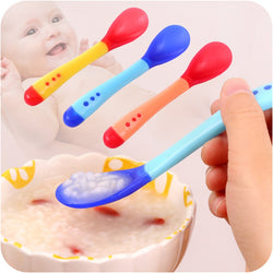 Newborn Baby Eating Spoon